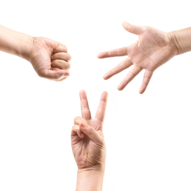 mãos fazendo: pedra, papel, tesoura - thumb stones imagens e fotografias de stock