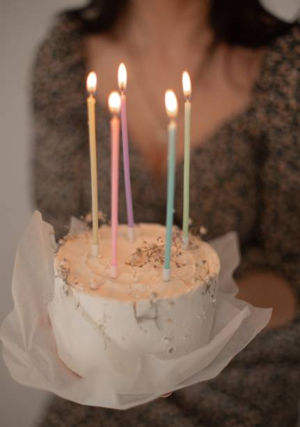 istock Man Lighting birthday Candles 1494251083