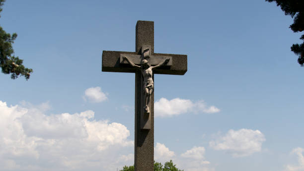 istock cross with cloud background in a cemetery 1494252329