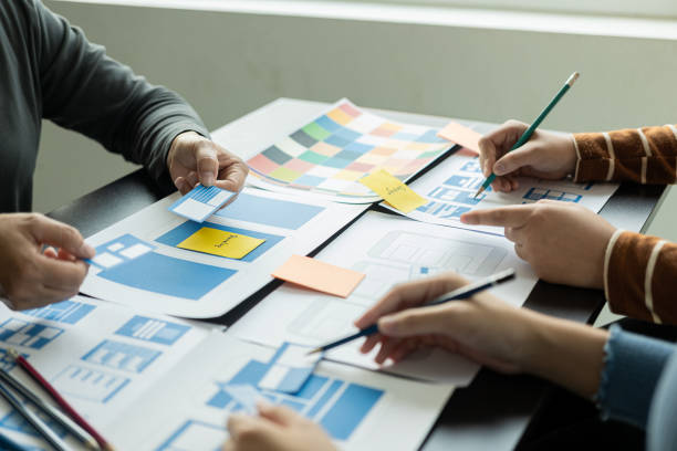 istock A team of web designers are working together to develop a mobile-responsive website with UI/UX Front End Designer Preview.Website Development Ideas on Sa Smartphone 1494256786