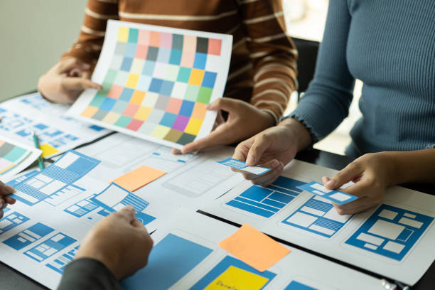 istock A team of web designers are working together to develop a mobile-responsive website with UI/UX Front End Designer Preview.Website Development Ideas on Sa Smartphone 1494256798
