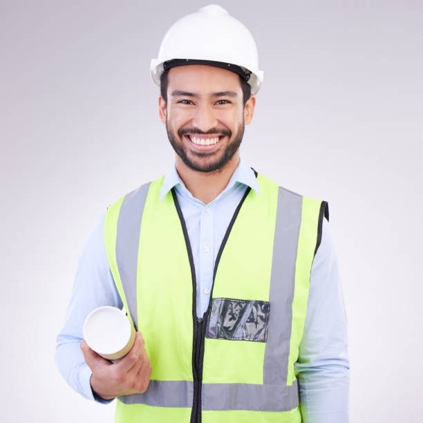 istock Portrait of construction worker man isolated on a white background engineering, architecture and design career. Happy face of asian builder, contractor or industrial person with safety gear in studio 1494257373