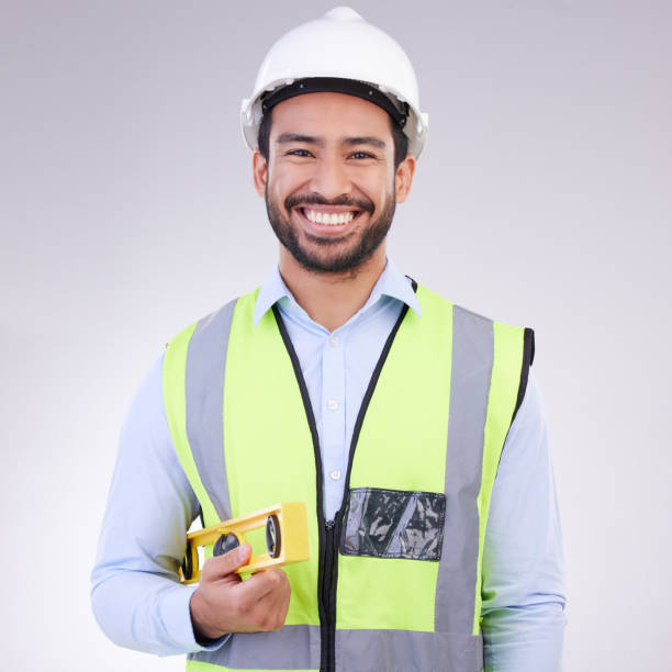 istock Construction worker in portrait, man with tools and smile, architect or engineer in building industry on studio background. Happy male contractor, mockup and professional builder with helmet 1494257390