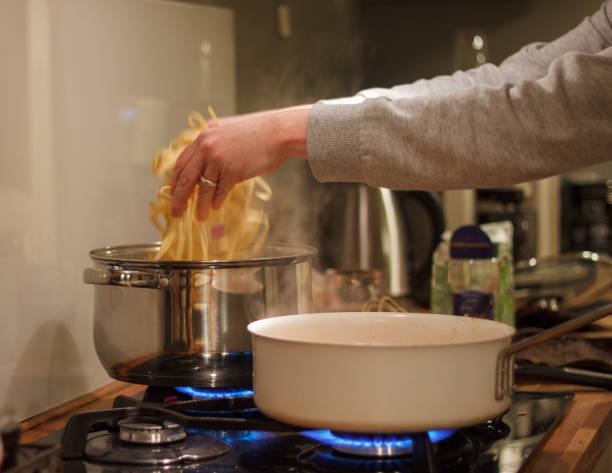 istock Pasta ready to get cooked in boiling water in a casserole 1494257580