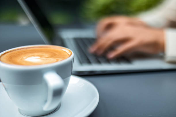 istock Woman using laptop ,focus on coffee 1494257930