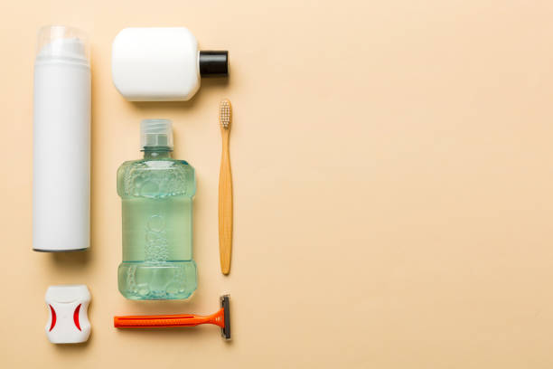 istock Composition with bath cosmetics on table. razor, toothpaste, soap, gel, toothbrush, mouthwash and other various accessories. Cosmetics for skin health. Bath Mockup for your logo 1494258809