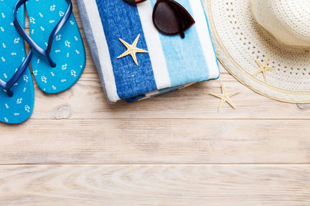istock Summer vacation concept flat lay. straw hat beach accessories and towel top view. Space for text. travel concept 1494258828