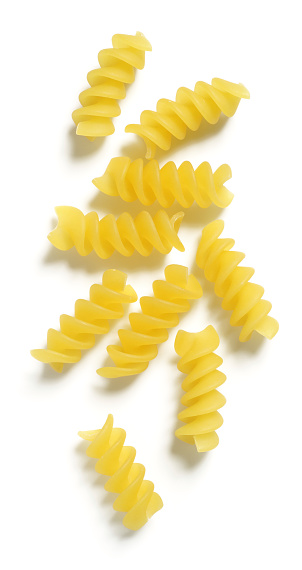 Dry rotini (or corkscrew) pasta isolated on 255 white.