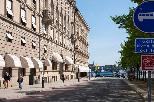 Vienna, Austria - June 8, 2023: Street view in center of Vienna city, Austria in the morning. Cityscape of capital with cars, buildings, street, store.