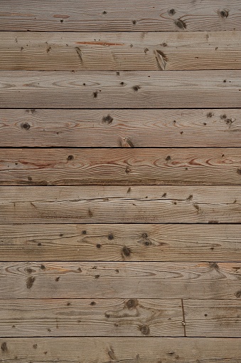 A wooden surface showcasing a variety of marks and stains