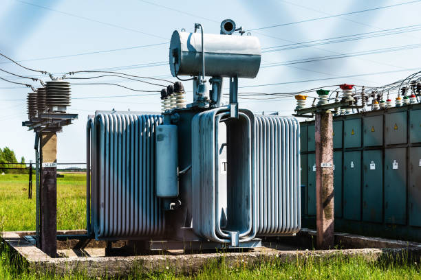 istock High voltage transformer against the blue sky. Electric current redistribution substation.Summer rural day. 1494264939