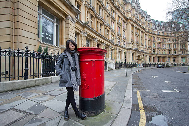 Red postbox in a pedestrian zone in Durham city centre