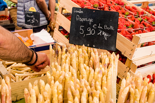 Stall of an asparagus seller in the market