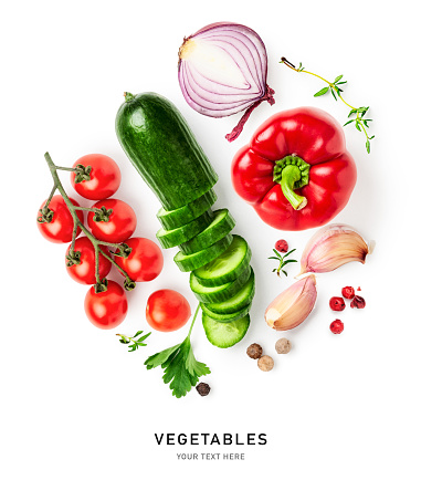 Fresh garden vegetables composition. Pepper, onion, cucumber, tomato, thyme and garlic isolated on white background. Healthy eating and dieting concept. Creative layout. Flat lay, top view