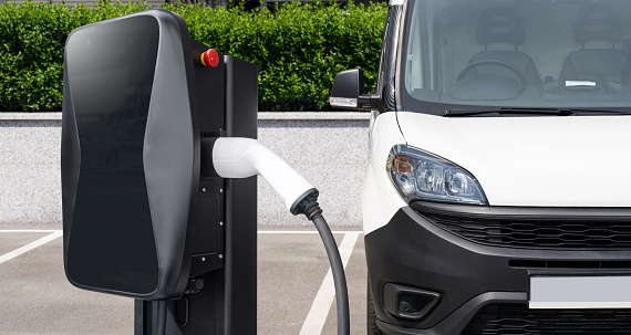 Electric delivery van with electric vehicles charging station.