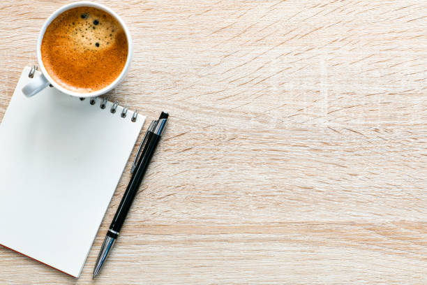 istock View from the office to the desk with a notebook and a cup of coffee. 1494270467