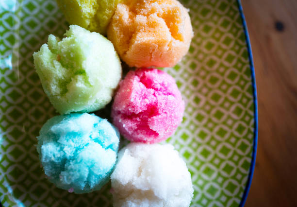 What a colorful, cute snack. I bought them because the color is vibrant.  It is called Kue Moho (Huat Kueh).  Steamed tiny cakes. Huat Kueh aka Fatt Koh is a traditional Chinese steamed cake especially for festive season like Chinese New Year.   I have no idea what makes the color respectively. The taste is very light.