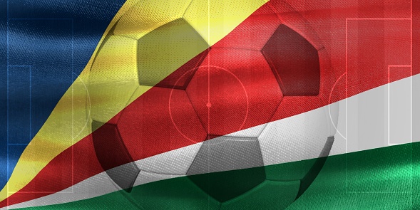 3D rendering of the flag of Tanzania with a soccer ball