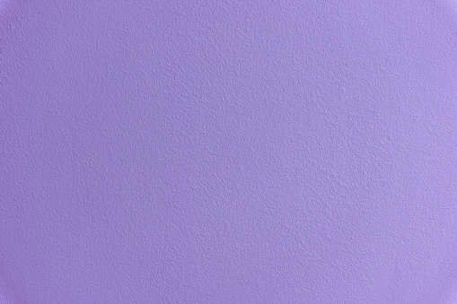 purple textured background of plastered wall. blue texture. Pure lavender background with a place to copy text.