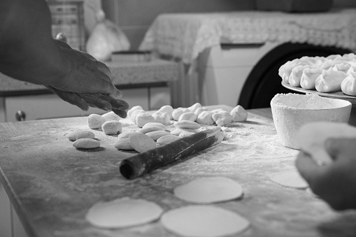 Elderly parents are making dumplings for their children