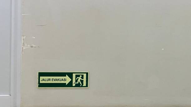 istock Evacuation path instructions emblazoned on the wall of a building 1494277554