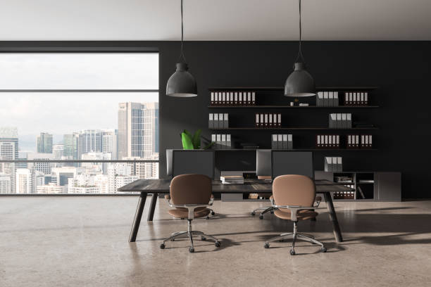 istock Grey office coworking interior with pc computer on desk, shelf and window 1494281983