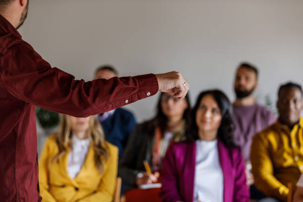 istock Confident businessman holding a presentation for his coworkers 1494283496
