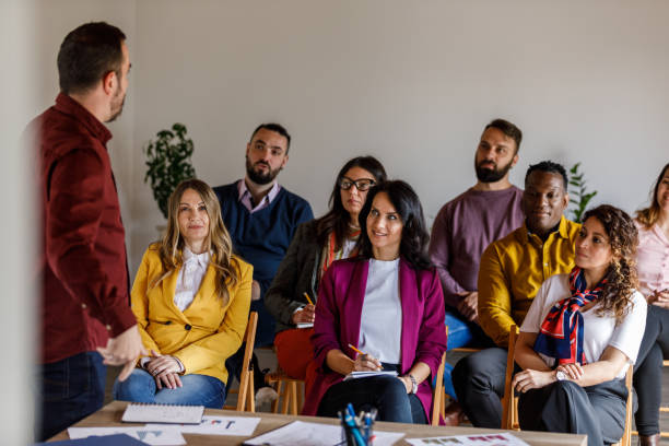 istock Confident businessman holding a presentation for his coworkers 1494283565
