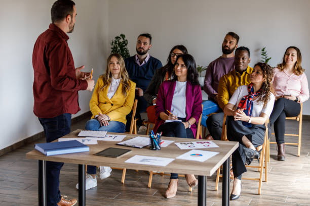 istock Confident businessman holding a presentation for his coworkers 1494283776