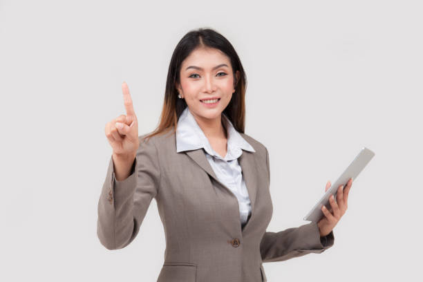 istock business woman hold tablet on white background 1494284237