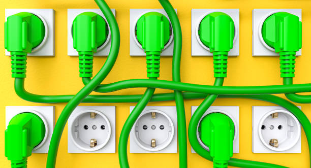 istock green Schuko plugs and yellow wall. 1494286741