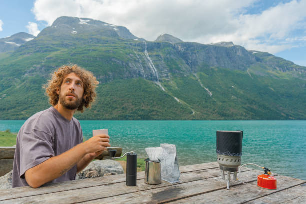 istock Man brewing coffee in nature 1494287289