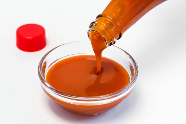 Pouring Hot Sauce in a Bowl