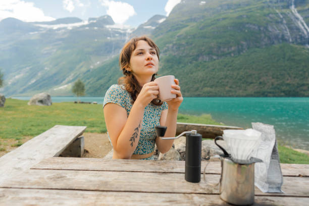 istock Woman brewing coffee in nature 1494288364