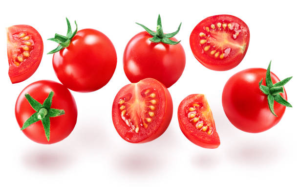 istock Ripe cherry tomatoes and tomato slices levitating in air. File contains clipping path. 1494290728