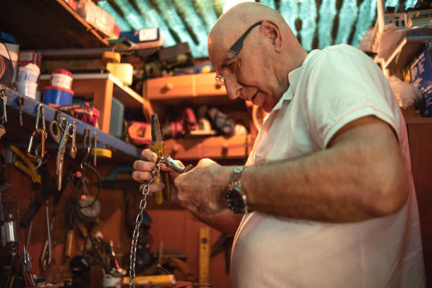 istock Removing links of the chain to reuse it for another craft 1494290822