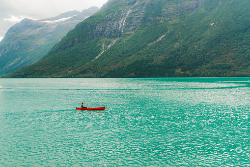 Scenic  view of young man  canoeing on the lake in Norway