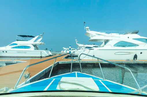 Motorboats at marina, background with copy space, full frame horizontal composition