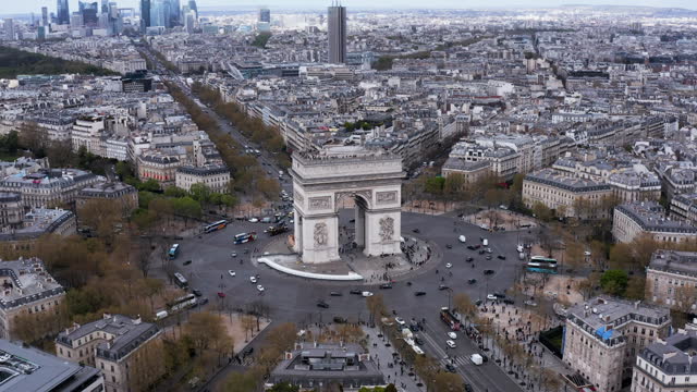 Aerial above Arc de Triumph with cars and traffic, France
