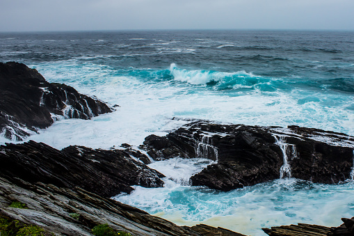 The tempestious sea, with waves breaking on the rocky Tsitsikamma coastline, South Africa.