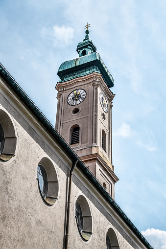 Low Angle View Of Majestic Heilig-Geist-Kirche Clocktower In Munich, Germany