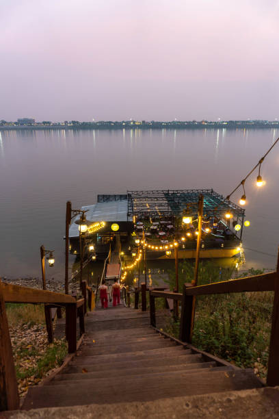 istock Path with stairs and lanterns leading to a waterfront bar in Thakhek, Laos 1494302455