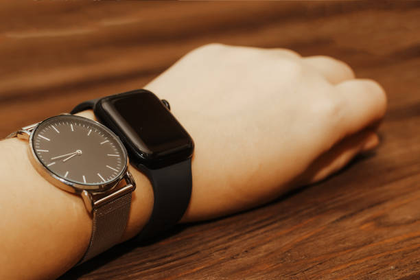 Black technological smart watches and ordinary mechanical watches with a dial.