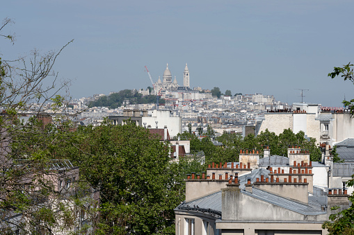 Paris, France - 05 20 2023: . View of Montmartre district and the Basilica of sacred heart from Square des Chaufourniers