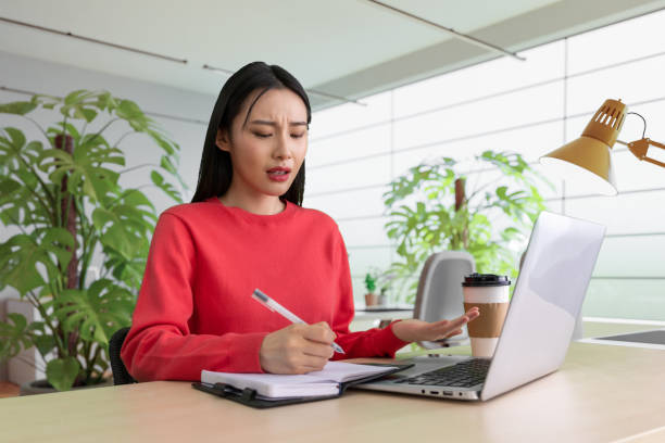 istock Beautiful woman using laptop at cafe 1494308942