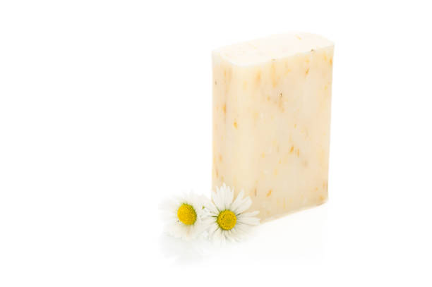 istock Natural cosmetics concept. stack of handmade soap and chamomiles flowers. 1494310088