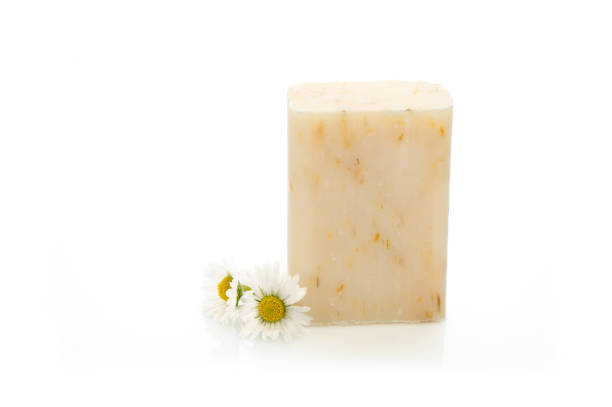 istock Natural cosmetics concept. stack of handmade soap and chamomiles flowers. 1494310101