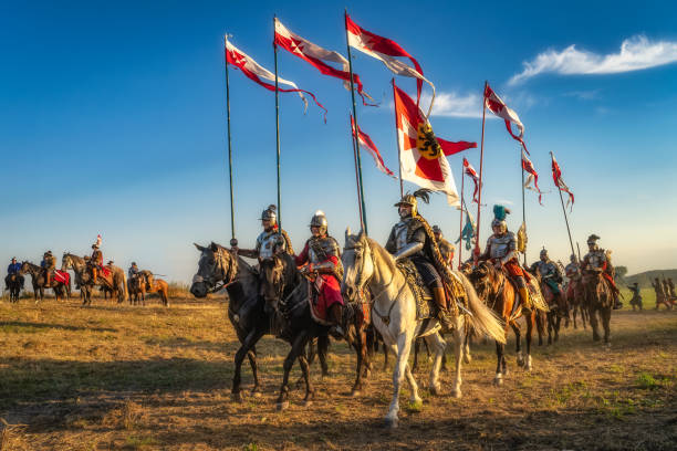 Gniew, Poland, Aug 2020 Polish Hussars riding on horses and carrying emblems and flags, heavy cavalry, historical reenactment, Battle of Gniew