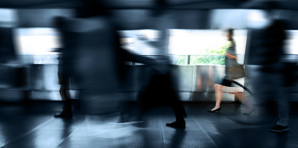 Abstract background of blurred movement of people in the underpass. Abstraction, motion blur