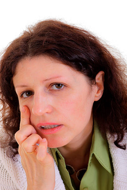 istock Woman checking skin face 149431566